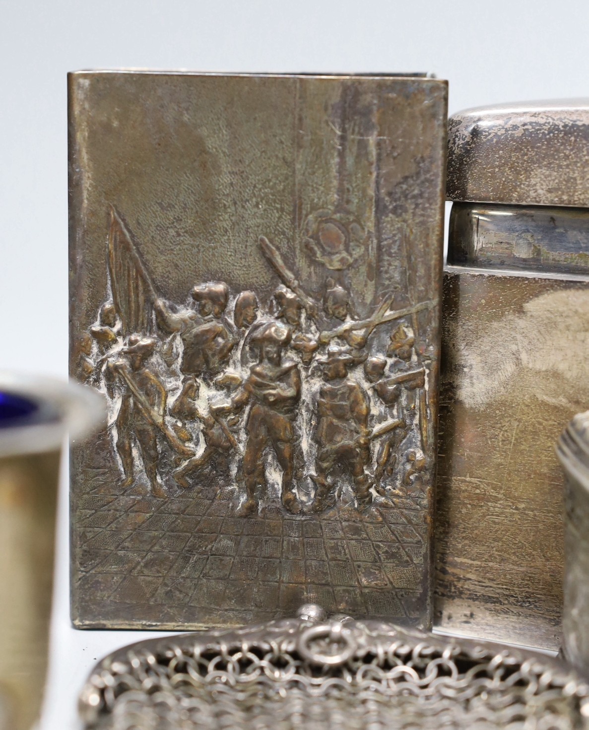 A George V silver mounted cigarette box, 16.9cm and a group of assorted white metal items.